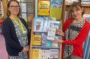Beatrice Drecq, senior supervisor at Exmouth Library, with Gina Awad and the display of dementia support books