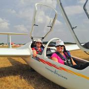 Beccy and Liisi in a glider.