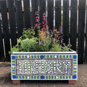 Planter adopted by Dementia Friendly Honiton, with art work by Phil Creek