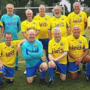 Jonathan Hirons (pictured kneeling, third from right) and his team of walking footballers