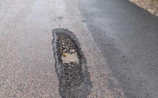 A pothole next to the patched-up section where Mr Lee's car was damaged