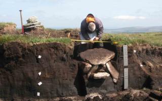Excavating the cist at Whitehorse Hill in 2011