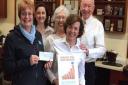 Alan Rowe MBE and his barbershop team supporting the Honiton Admiral Nurse campaign.