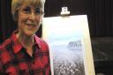 Lynda White and her pastel painting of Beer Head cliffs.