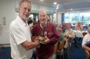 Senior's Captain Steve Thompson, on the left, presenting the winner Geoff Hughes with the Trophy