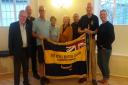 Axminster RBL members with Lister Cup emblazoned standard and new centenary pennant