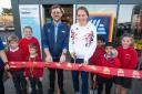 Store manager James Spry, Giselle Ansley and children performing the opening ceremony