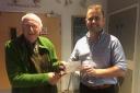 Mr David Rickard of the Honiton Lions presenting a cheque for £250 to Mr Nick Wadey of The Royal British Legion in Honiton.