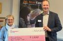 Richard Foord MP presents the cheque to Pat Baldwin