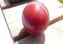 A cricket ball on the scorers table.