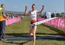 Innes FitzGerald crossing the finish line at the SIAB International Cross Country Championships last year