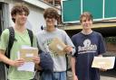 Students show off their results letters