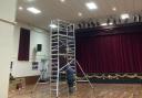 Installing new lighting in the auditorium