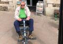 Steve Morris with his motorised buggy outside the Gateway Theatre Seaton