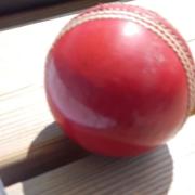 A cricket ball on the scorers table.