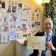 Tiverton and Honiton MP Richard Foord with the winning Christmas card design.