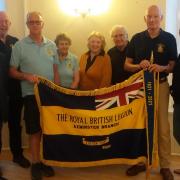 Axminster RBL members with Lister Cup emblazoned standard and new centenary pennant