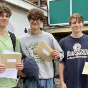 Students show off their results letters