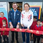 Store manager James Spry, Giselle Ansley and children performing the opening ceremony