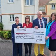 Jubilee Lodge handing the money to Devon Air Ambulance