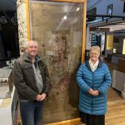 Lydia’s grandchildren, Barry Ebdon (the donor) and his cousin Marina Tressider with the Thomas Whitty Rug now on display at the Axminster Heritage Centre