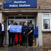 The PCC with local MP Richard Foord, the town mayor and police at Honiton Police Station