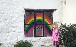 Izzy, six, from Seaton, with the rainbow she made Picture: Steven Downer