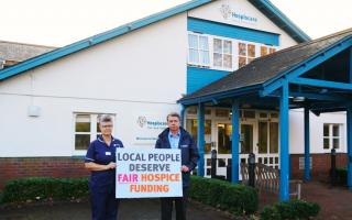 Hospiscare CEO and nurse with campaign banner